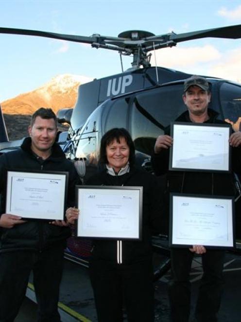 Over The Top Helicopter Company senior pilot Stephen Beck (left), chief pilot and owner Louisa...