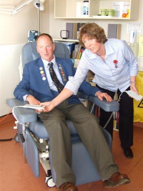 Owaka Lions Club member Alan Bichan is shown by district nurse Lynn Dawson how to operate one of...