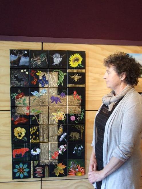 Owaka Museum director Kaaren Mitcalfe admires the art work created by 28 members of Art South...