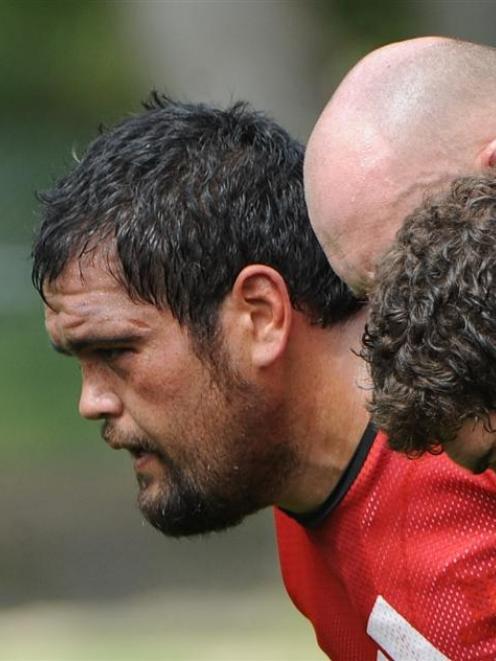 Packing down at scrum practice is David Te Moana (left) alongside Jason Rutledge (centre) and...
