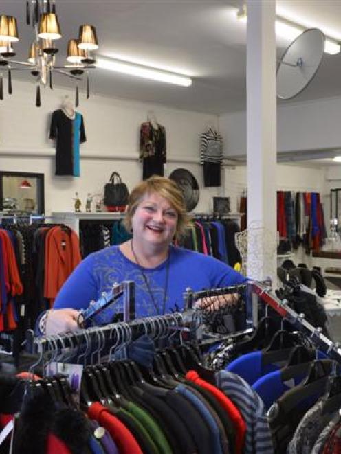 Paint The Town Red clothing store owner Diane McKenzie in her new premises in St Andrew St. Photo...