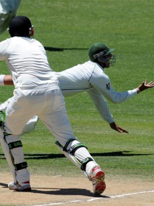 Pakistan's Salman Butt attempts a catch on New Zealand's Daryl Tuffey on the third day of the...