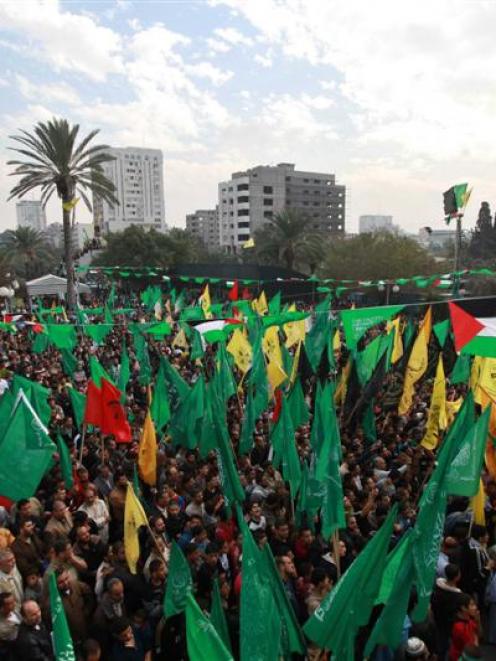 Palestinians celebrate what they claim is a victory over Israel after an eight-day conflict,...