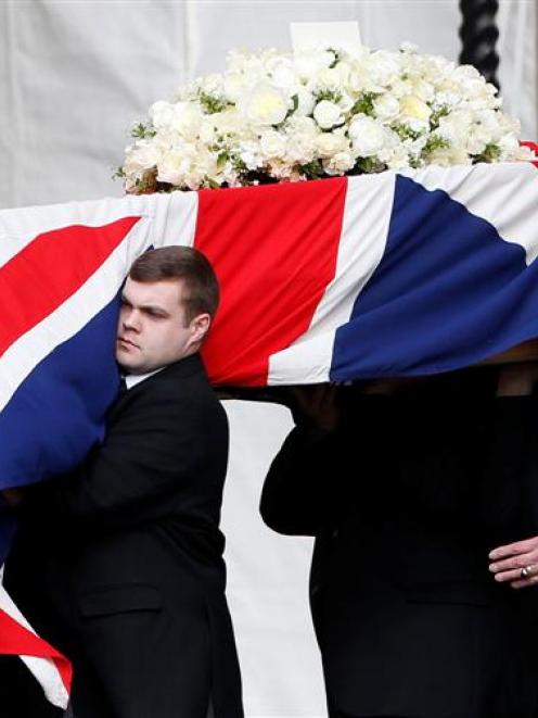 Pallbearers carry the coffin of former British prime minister Margaret Thatcher into the Palace...