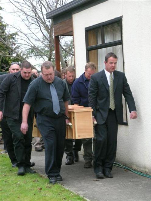 Pallbearers (from left) Mark Clayton, Lance Clayton, Greg King, Ritchie White, Peter White and...