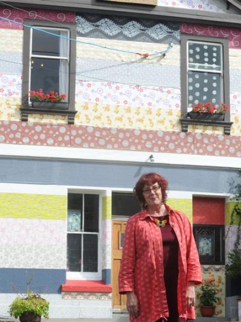 Pamela Brown and her wallpaper house. Photo by Craig Baxter.