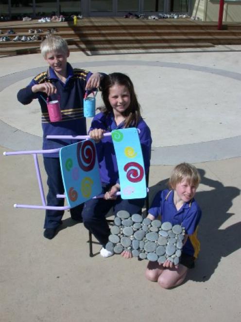 Papakaio School pupils with some of the goods made from recycled materials sold last week. From...