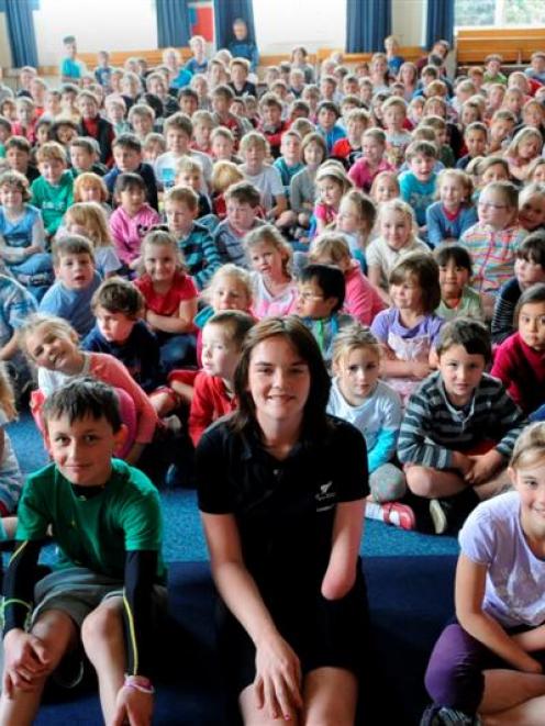 Paralympian athlete Holly Robinson (centre) with pupils at the Kaikorai Primary School yesterday....