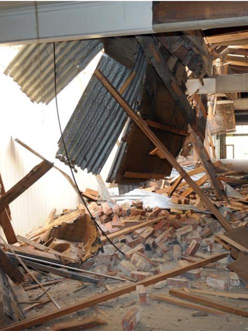 Part of a double brick wall between two buildings in Dunedin's Princes St collapsed and fell...