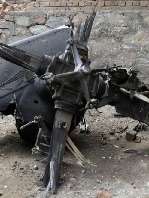 Part of a Turkish helicopter lies on the site of crash, in which 12 Turkish soldiers on board and...