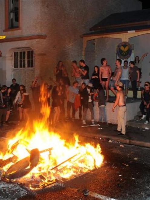 Partygoers celebrate the All Blacks' Rugby World Cup win with a fire in Hyde St, Dunedin, last...