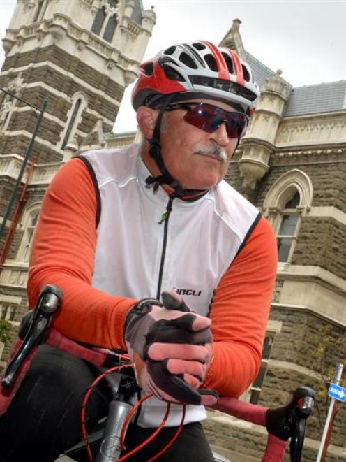 Pascal Sutherland sits on his bicycle outside the Dunedin District Court. Photo by Stephen Jaquiery.