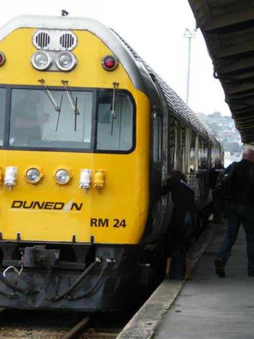 Passengers disembark from the Taieri Gorge Railway's Silver Fern railcar at Oamaru Railway...
