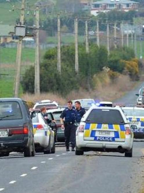 Patrol cars surround a Mitsubishi V3000 in Gladfield Rd after a high speed pursuit from Balclutha...