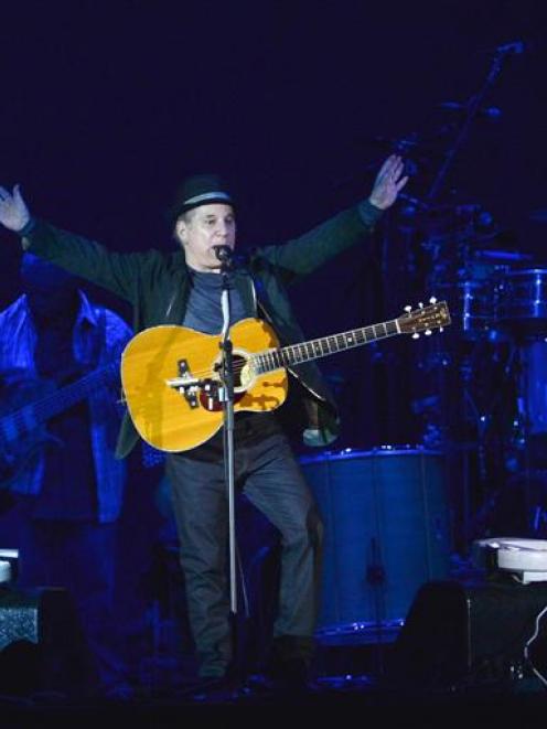 Paul Simon responds to an appreciative crowd at Forsyth Barr Stadium on Saturday night. Photo by...