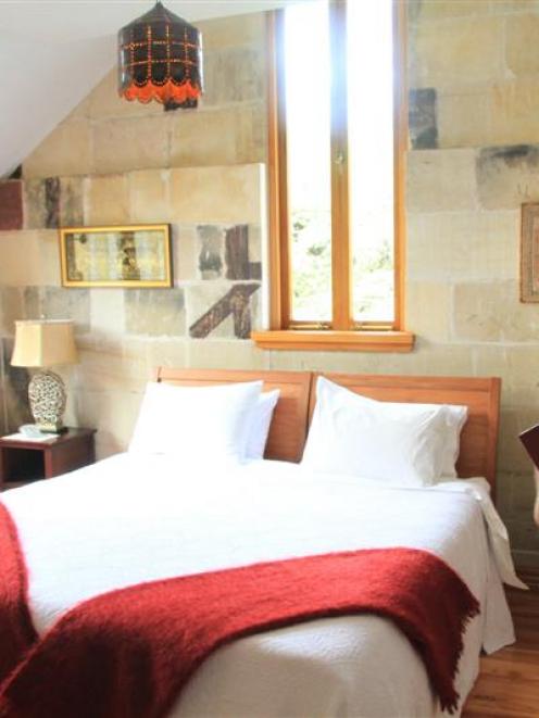 Pen-y-bryn Lodge co-owner James Glucksman inspects a room of the historic luxury lodge in Oamaru...