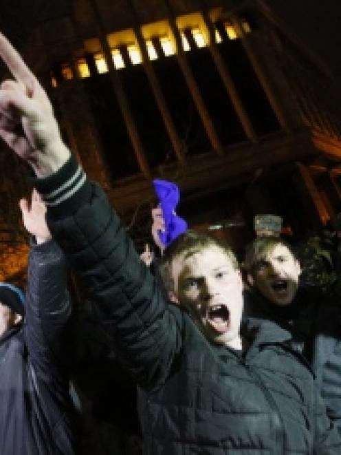 People shout slogans during a pro-Russian rally in Simferopol, Crimea. REUTERS/David Mdzinarishvili