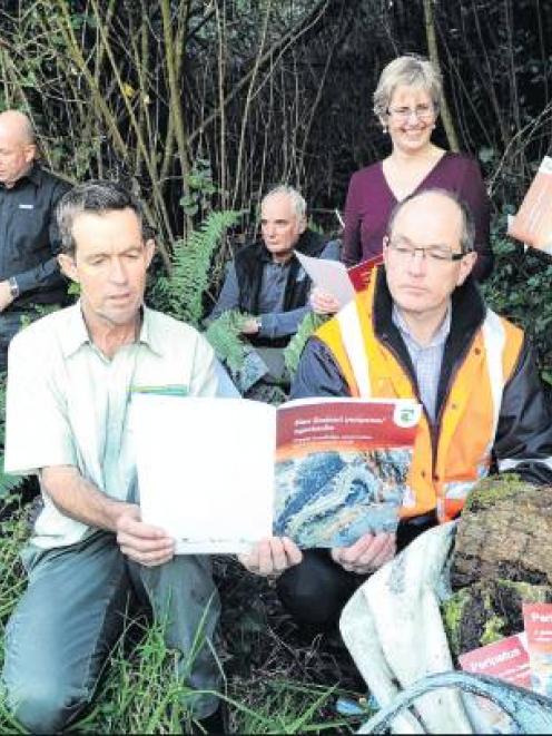 Peripatus fans (front) Department of Conservation conservation services manager David Agnew (left...