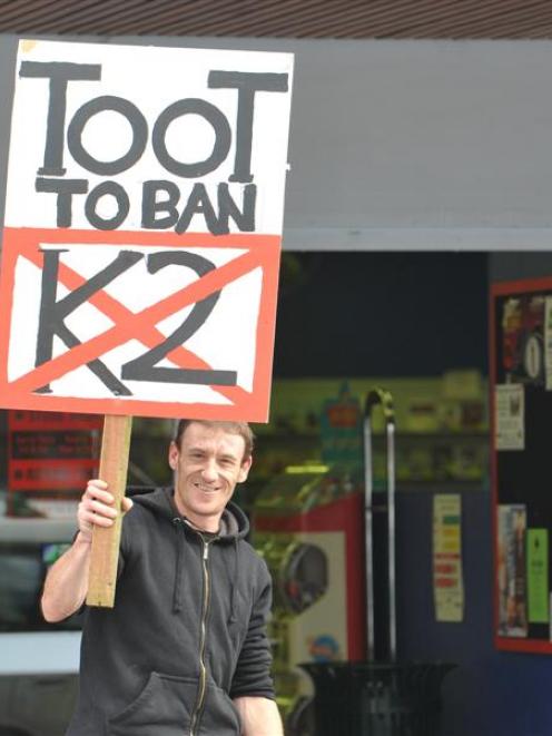 Pete Andrews jun protests last Friday outside shops in Mosgiel known to sell synthetic cannabis...