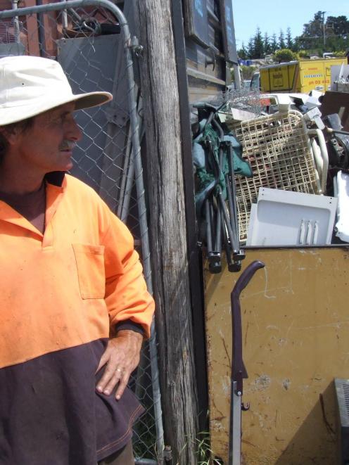 Pete Phillips scans the packed recycling yard.  Photos by Matthew Haggart.