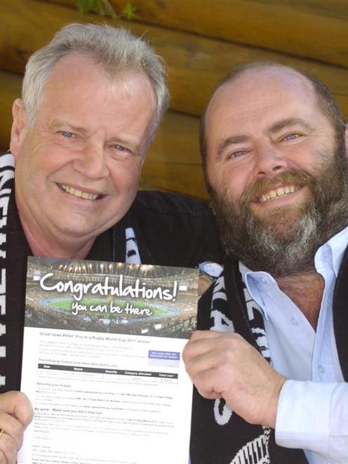 Pete Thomson (right) and friend John Hannam celebrate the news they are off to the Rugby World...