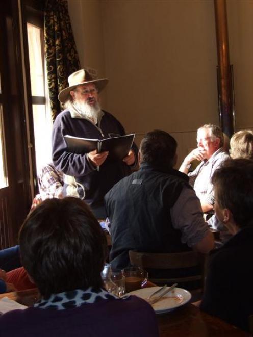 Phil Garland, who describes himself as a balladeer and singing historian, vocalises a narrative...