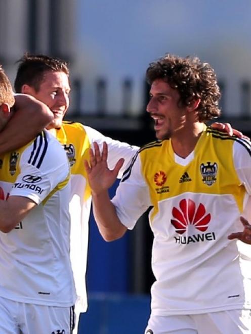 Phoenix players celebrate a goal against the Central Coast Mariners in Gosford. Photo Getty Images