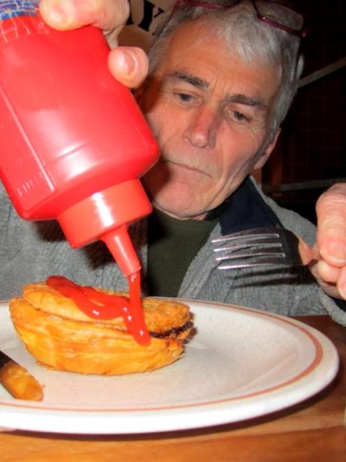Jim Russell gets ready to tuck into a deep-fried Jimmy's pie. Photos by ODT