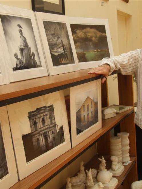 Photographer Derek Golding with some of his photographs on display at Omru Blue. Photo by Sally Rae.