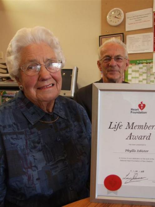 Phyllis Isbister displays her Heart Foundation of New Zealand life-membership certificate watched...