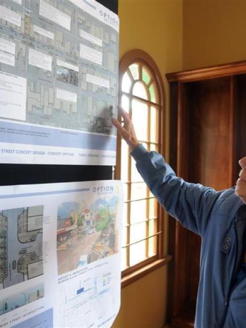 Phyllis Munro, of South Dunedin, considers one of the redevelopment choices for the retail centre...