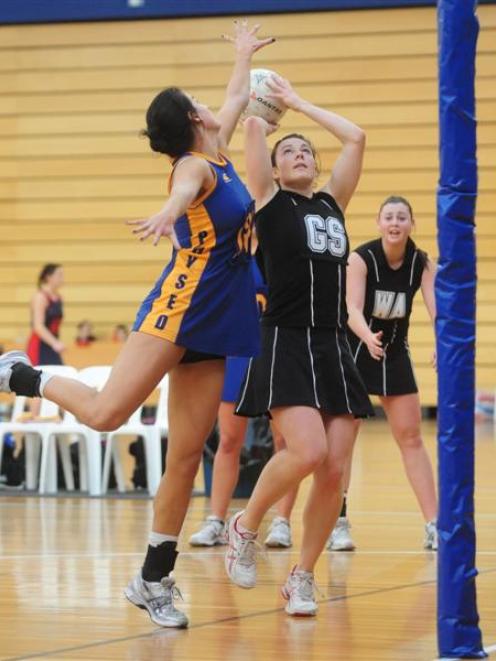 Phys Ed A goal keep Sam Stewart tries to block a shot from Sourthern A goal shoot Katie Shearer...