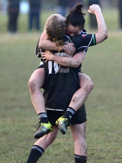 Pirates players Larissa Muir (back to camera) and Sam Wong celebrate as the final whistle sounds...