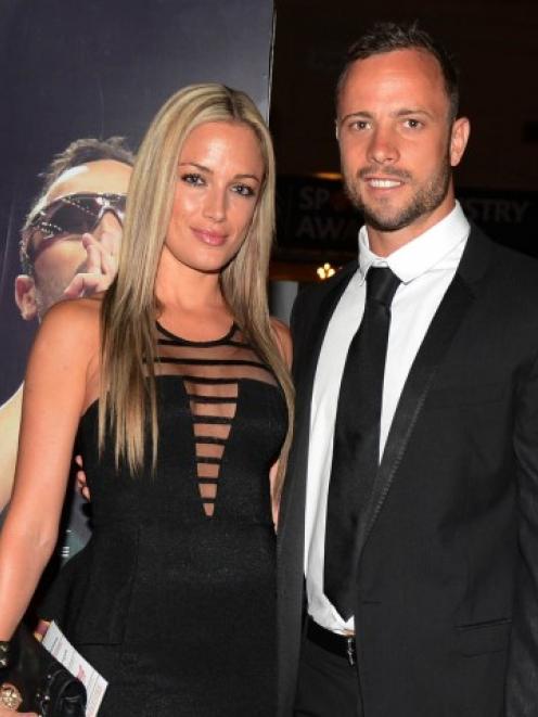 Pistorius and Reeva Steenkamp pose for a picture at a function in Johannesburg earlier this month.