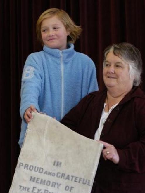 The principal of Forbury School, Janice Tofia, explains the significance of a marble World War 1...