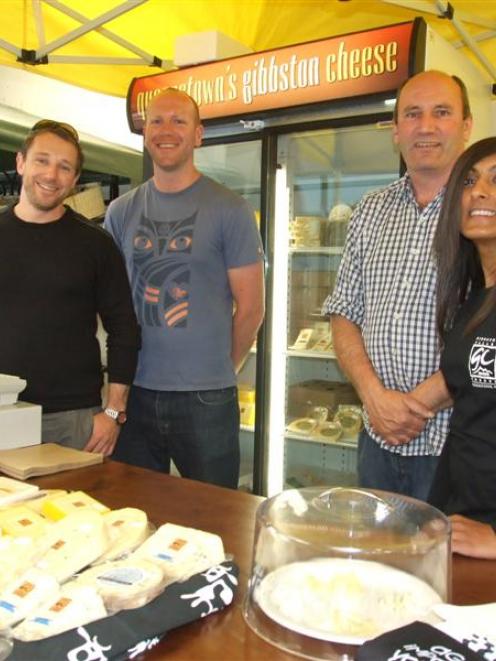 Pleased to be trading are, from left, Shotover Markets organisers Paul Clark and David Thomson,...