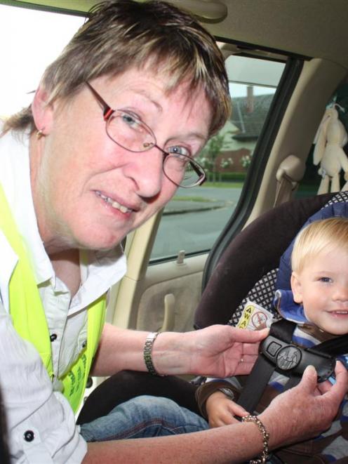 Plunket Otago-Southland car seat services manager Kathryn Impelmans checks 21-month-old Luke...