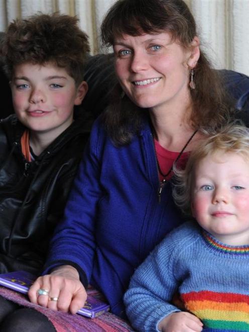 Poet Emma Neale relaxes at home with children Abe (10) and Zac (2). Photo by Craig Baxter.
