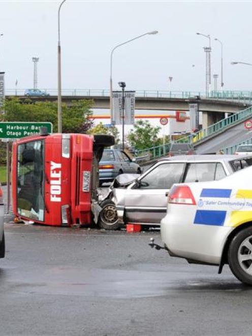Police at the scene of a crash near Queens Gardens yesterday. The crash occurred after a 17-year...