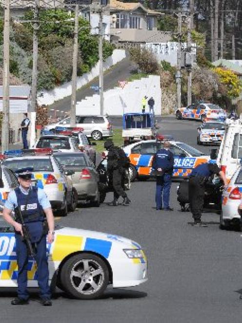 Police block entry to the area near an Armed Offenders Squad callout in the Dunedin suburb of...