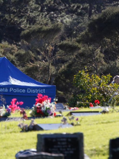 Police continue their search of the cemetery on Eskdale road in Birkdale in relation to the...