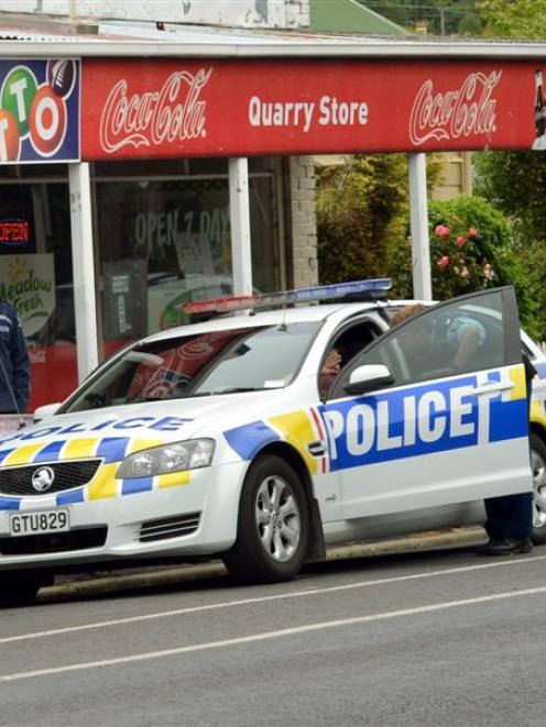 Police cordon off the Quarry Store in Northeast Valley after a female shop assistant was...