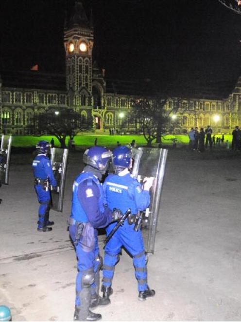 Police face off with students on the University of Otago campus early yesterday. Photo by Craig...
