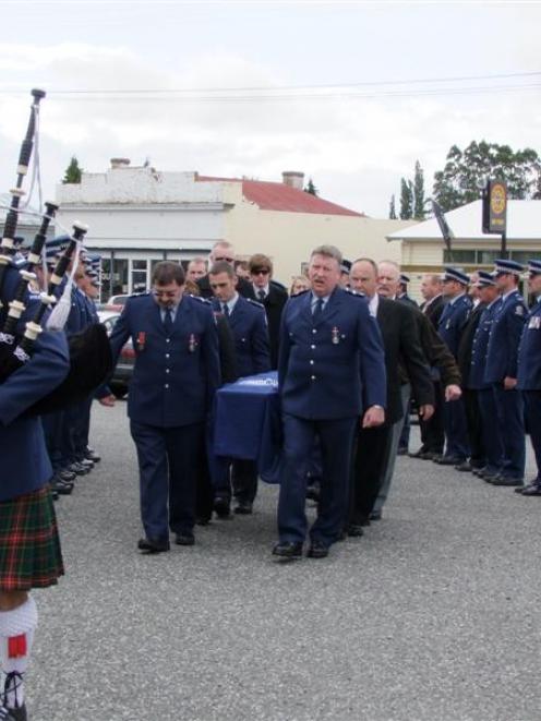 Police form a guard of honour as the coffin of former Riversdale policeman Jacob Schriek is...