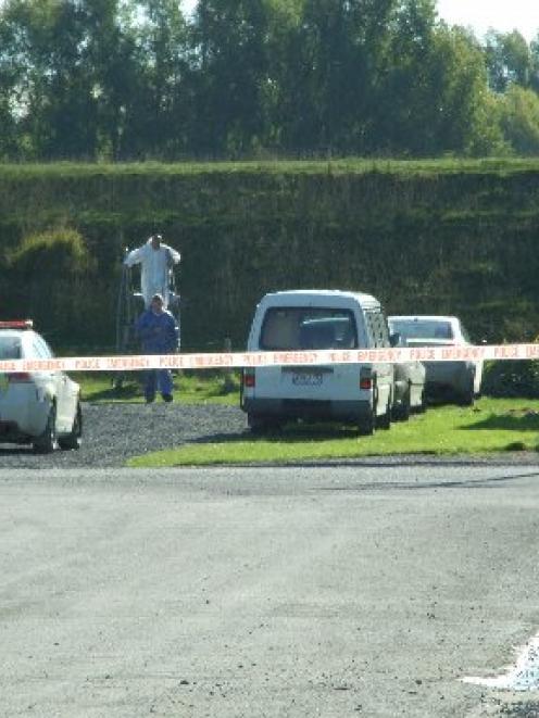 Police from Dunedin and Balclutha cordoned off a section of the riverbank near View St, Balclutha...