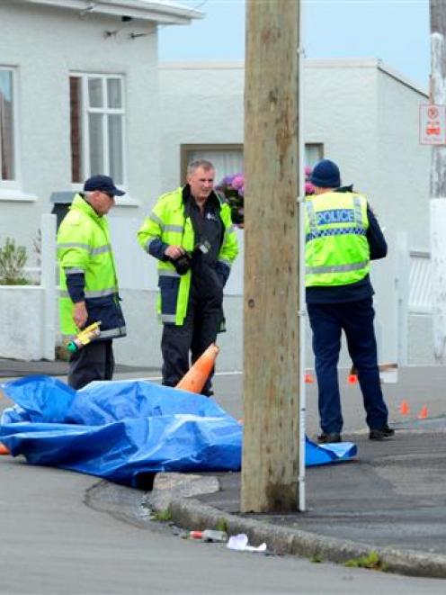 Police inspect the Argyle St and Elgin Rd intersection after a motorcycle crash yesterday. Photo...