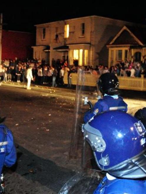 Police move to disperse a Castle St crowd. Photo by Craig Baxter.