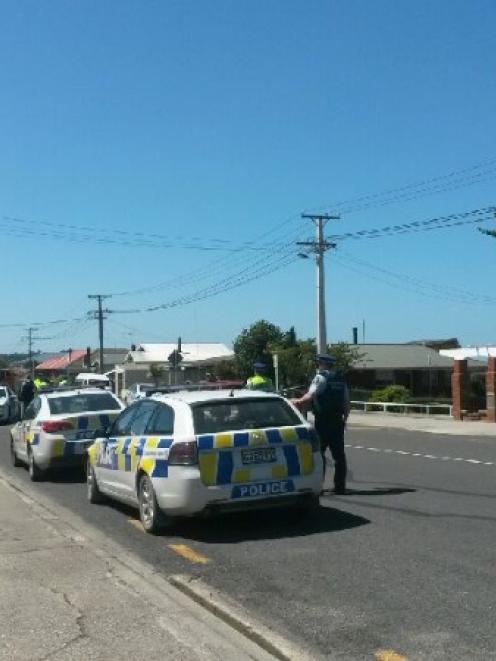 Police outside South Otago High School this afternoon. Photo: Sam White