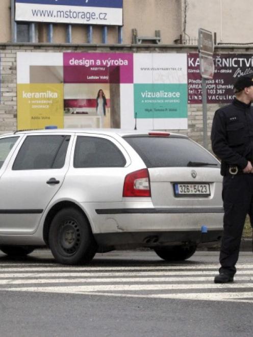Police stand near the site of a shooting in the eastern Czech town of Uhersky Brod. Photo by Reuters
