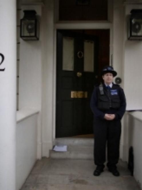 Police tape lines the outside of the house of Eva Rausing in Knightsbridge, London. (Photo by...